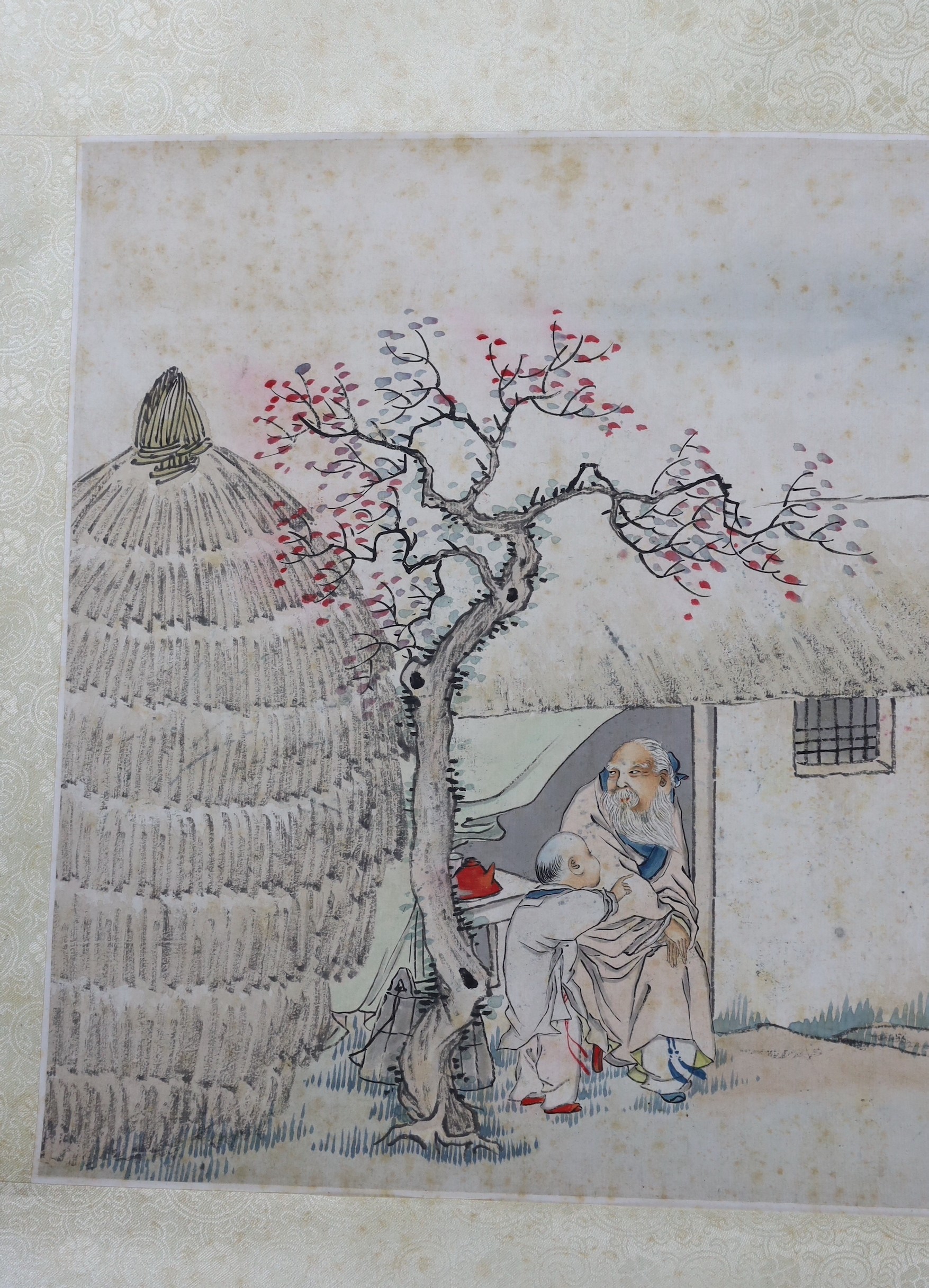 A Chinese scroll painting on paper of a sage and a boy in a hut, early 20th century, image 31.5cm x 42.5cm